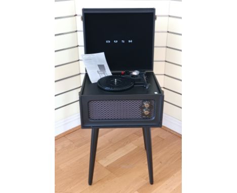 A Bush classics turntable, on four removable tapered legs, black leather effect finish, with cartridge and manual 