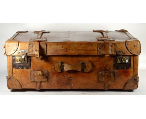 A late 19th century substantial tan leather traveling trunk/suitcase (85 x 56 x 32 cm).