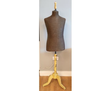An early 20th century dressmakers mannequin, adjustable height, on trypod base. 