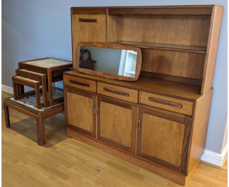 A mid 20th&nbsp;Gplan century display cabinet, with illuminated upper glass shelf, flanked by a single hinged door, opening t