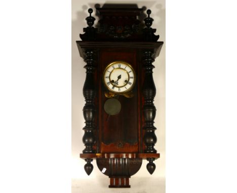An early 20th century American drop dial wall clock, the walnut veneered case housing an eight day movement, together with th