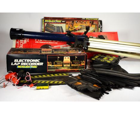A quantity of loose Scalextric, together with a telescope, a metal detector, model toy cars, a 'nodding dog' animal models an