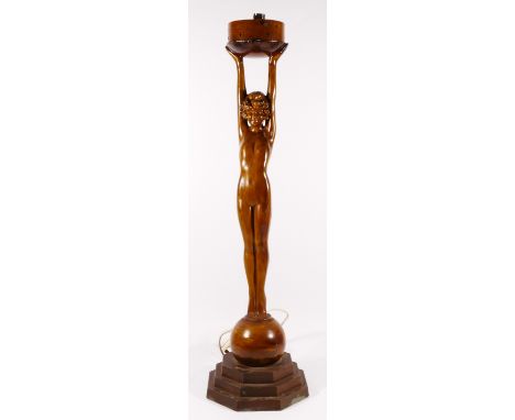 An Art Deco style figural table lamp, cold painted spelter, depicting an outstretched flapper girl upon a stepped base.73cm t