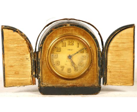 An Edwardian French bedside alarm clock, having 8 day movement and traveling case, together with a miniature brass 8 day carr