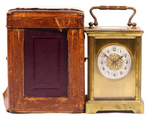 An Edwardian 8 day brass carriage clock, with original traveling case and key.12cm tall. 
