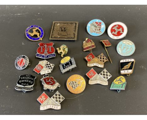 A selection of Isle of Man TT enamel lapel badges, some from the 1960s.