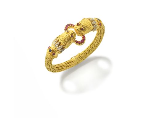 LALAOUNIS: GEM-SET BANGLEOf woven foxtail linking, terminating in lion's head motifs, with engraved detail, beaded and ropetw