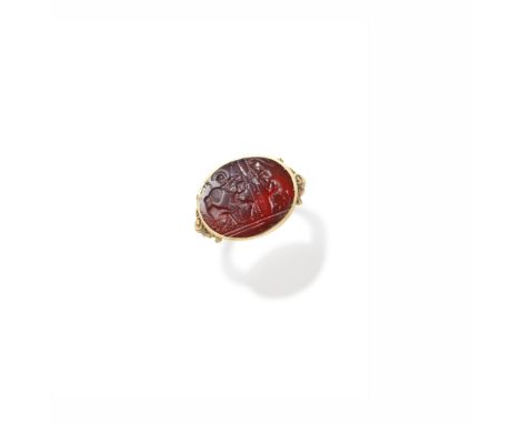 HARDSTONE INTAGLIO RING, 19TH CENTURYThe sard intaglio, possibly depicting a scene with Hector and Achilles, between trifurca