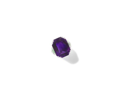 BOUCHERON: ART DECO AMETHYST, JADE AND DIAMOND RING, CIRCA 1930The cut-cornered rectangular amethyst set between carved jade 