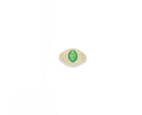 BULGARI: EMERALD AND DIAMOND 'TROMBINO' RING, 2000The oval-cut emerald set between baguette and brilliant-cut diamond shoulde