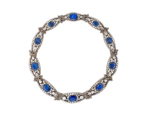 SAPPHIRE AND DIAMOND NECKLACE, 19TH CENTURYDesigned as a graduated series of openwork plaques, each centrally set with a cush