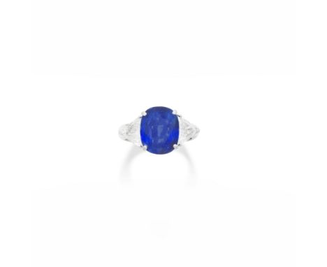 SAPPHIRE AND DIAMOND RINGThe cushion-shaped sapphire, weighing 5.48 carats, between triangular-cut diamonds, diamonds approxi