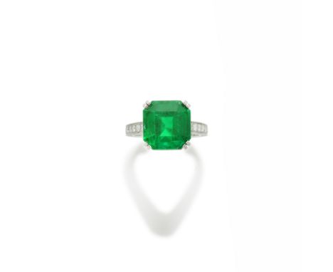 BOUCHERON: EMERALD AND DIAMOND RINGThe step-cut emerald weighing 7.34 carats, mounted on brilliant-cut diamond-set shoulders 