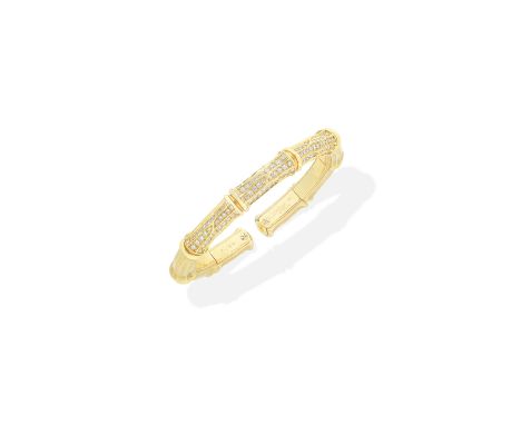 CARTIER: DIAMOND-SET 'BAMBOO' BANGLEOf sprung design, set to the front with brilliant-cut diamonds, mounted in 18 carat gold,