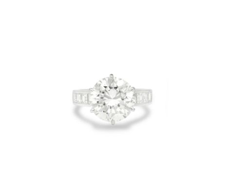 DIAMOND RINGThe brilliant-cut diamond, weighing 5.24 carats, between step-cut diamond shoulders, ring size KFootnotes:Please 