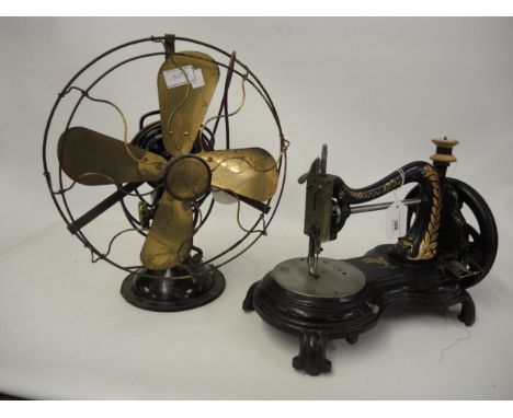 Early table model sewing machine by Jones & Company, together with a vintage electric fan 