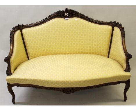 Late 19th / early 20th Century French carved two seat sofa with matching tub shaped upholstered chair in gold on cabriole sup