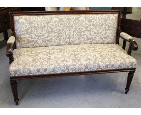 19th Century oak simulated as rosewood upholstered sofa with scroll arms, raised on turned hexagonal tapering supports 