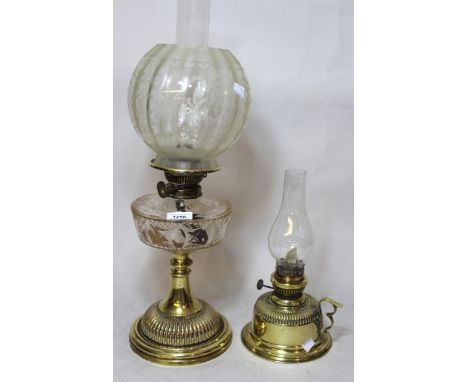 Victorian brass oil lamp with cut glass well, etched shade and chimney together with another brass oil lamp 