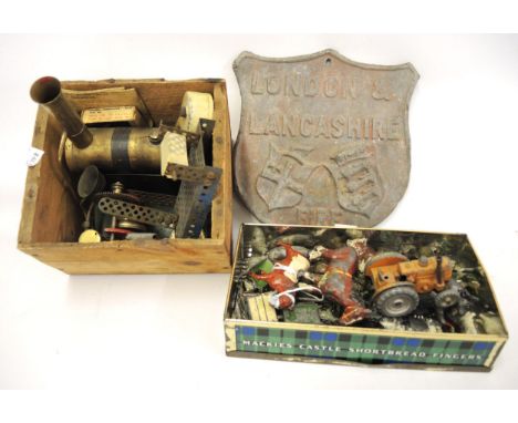 Cast lead firemark for London and Lancashire, an unboxed Mamod stationary steam engine with other accessories and a small tin
