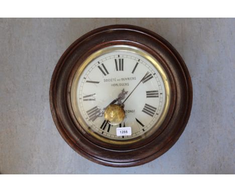 20th Century Continental oak circular wall clock with painted dial having Roman numerals 