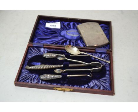 Silver cigarette case, pair of sugar tongs and a coffee spoon, 3oz t, together with three silver handled manicure items in a 