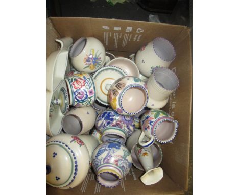 Two Poole pottery biscuit barrels with painted floral decoration, together with a large quantity of other similar vases and j