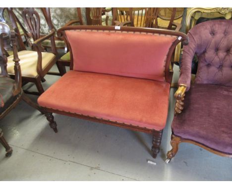 Small Victorian mahogany two seat drawing room sofa, the shaped padded back above an overstuffed seat and baluster turned fro