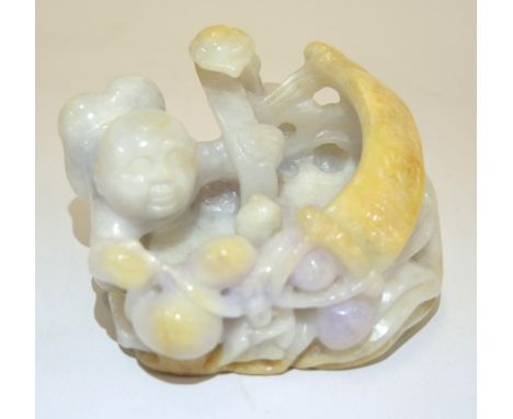 Small 20th Century deep relief multi coloured jade group of a crawling figure with a scroll, 7.5cm x 5.5cm approximately 