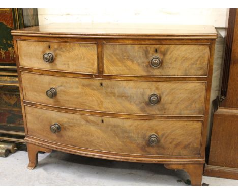 19th Century mahogany bow front chest of two short and two long drawers with brass knob handles, on splay bracket feet, 107cm