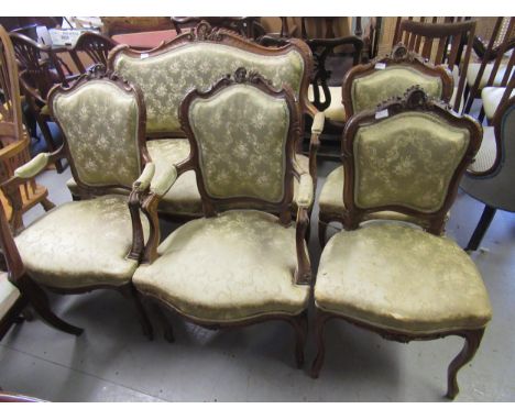 19th Century Continental walnut five piece drawing room suite, the floral carved frames with padded backs and overstuffed sea