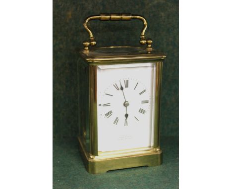 Small brass cased carriage clock, the enamel dial with Roman numerals, inscribed ' Examined by Hawley, Regent Street ', with 