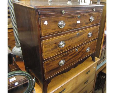 George III mahogany and line inlaid straight front chest, the moulded top above a brushing slide and three graduated drawers 