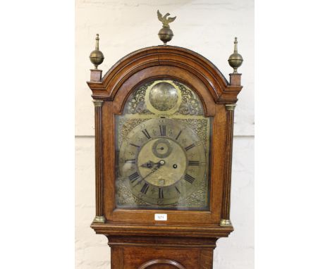 George III oak longcase clock, the broken arch hood with flanking pilasters above an arched moulded door and conforming plint