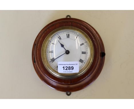 Circular walnut wall clock having enamel dial with Roman numerals, together with a 19th Century black slate marble mounted si