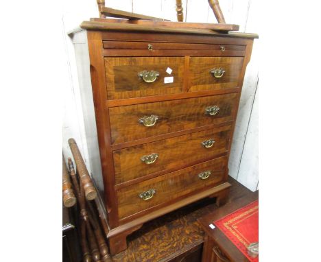 Mid 20th Century walnut chest of two short and three long drawers, with brushing slide on bracket feet 