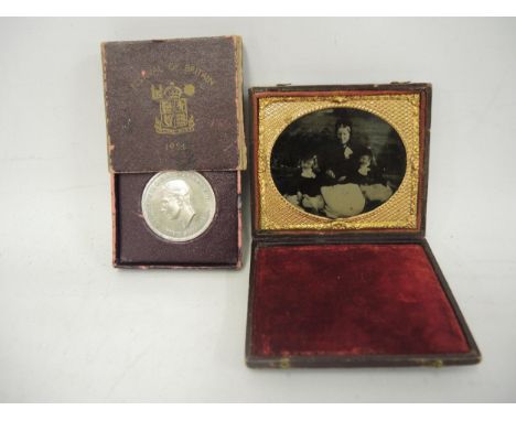 Leather cased Ambrotype with gilt metal oval mount and a Festival of Britain coin 