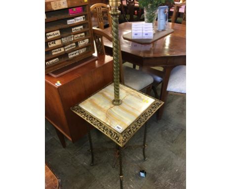 A brass and onyx standard lamp