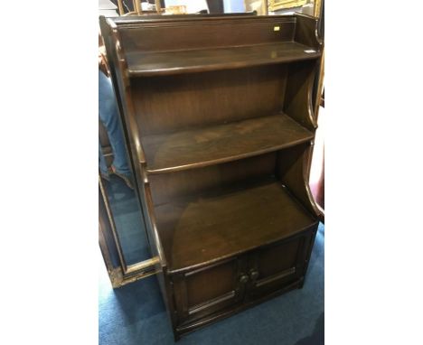 An Ercol graduating bookcase, 61cm wide