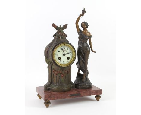 French spelter mantle clock, the two train movement striking on a bell, standing on a marble base with a standing figure of a