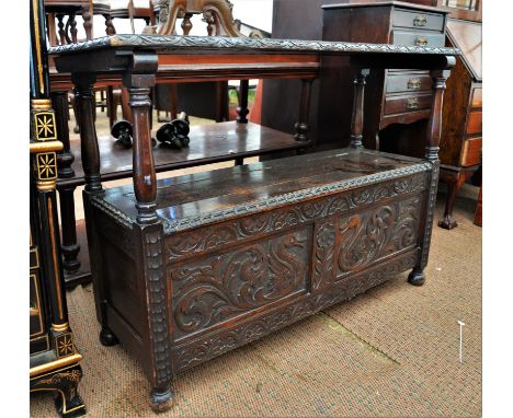 Oak monks bench, in the 17th Century style, rectangular sliding top above rectangular base with lifting lid, carved panelled 
