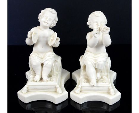 Pair of modern Belleek porcelain figures of children, both modelled seated, playing cymbals and pipes, some damages, printed 