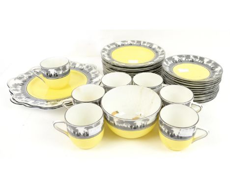 A part Foley China tea service, printed marks to base, decorated with printed bands of people in landscapes on yellow grounds