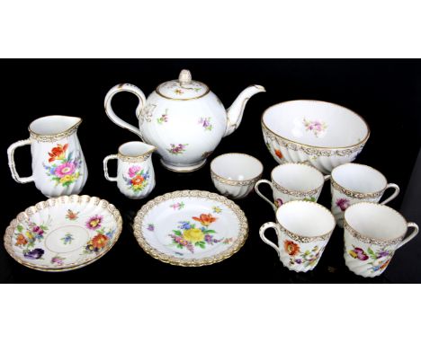 Early 20th century Dresden part tea service with gilt and coloured floral decoration,