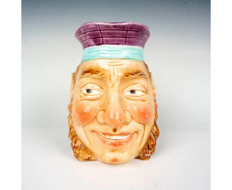 A large hand decorated vessel with blue glaze interior. Features a sailor with light brown handle. Sarreguemines backstamp. I