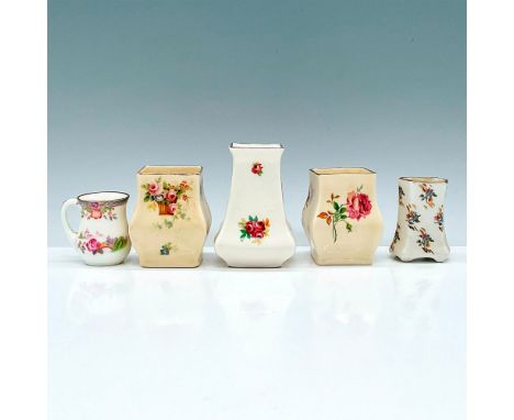 This grouping includes miniature vases and a pitcher all adorned with roses and a gilded rim. Four Royal Doulton &amp; One F.