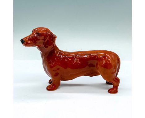 Good Companions series; naturalistic dog figure of a glossy brown Dachshund. Royal Doulton backstamp. This item has its origi