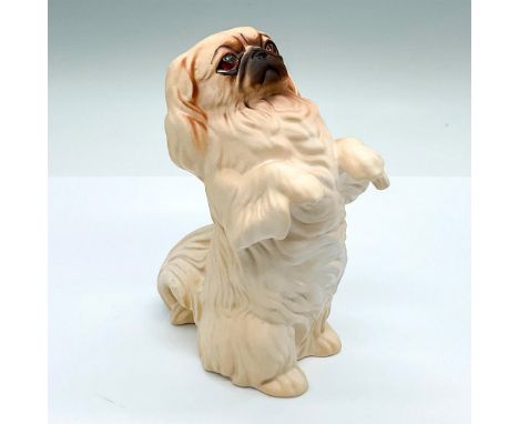 Good Companions series; naturalistic dog figure of a matte cream colored Pekinese. Royal Doulton backstamp. This item has its