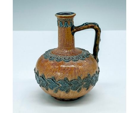 Small lovely, handled jug with narrow neck, light brown base with blue applique accents. Doulton Lambeth backstamp. Artist: V