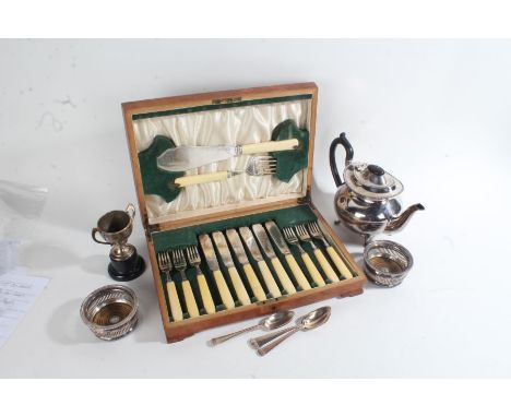 Silver plated ware, to include pair of small coasters, teapot, trophy cup, set of six grapefruit spoons, cased set of fish kn